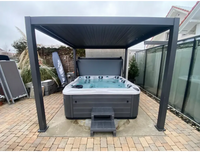Grått PassionSpa Devotion Spabad med modern design under pergola