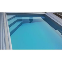 Modern Pooltime Exklusiv 12 mm PP-pool med turkost vatten och grå betongtrappor